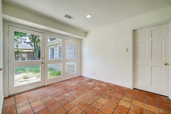 a view of an empty room and window