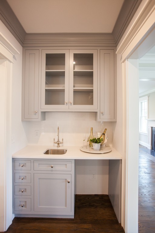 2 Cypress Road Wellesley, MA 02481 - Photo 17 of 22 a kitchen with white cabinets and sink