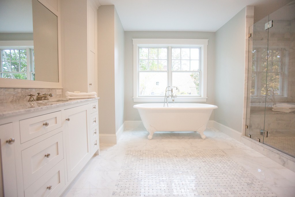 2 Cypress Road Wellesley, MA 02481 - Photo 18 of 22 a bathroom with a double vanity sink a mirror and a bathtub