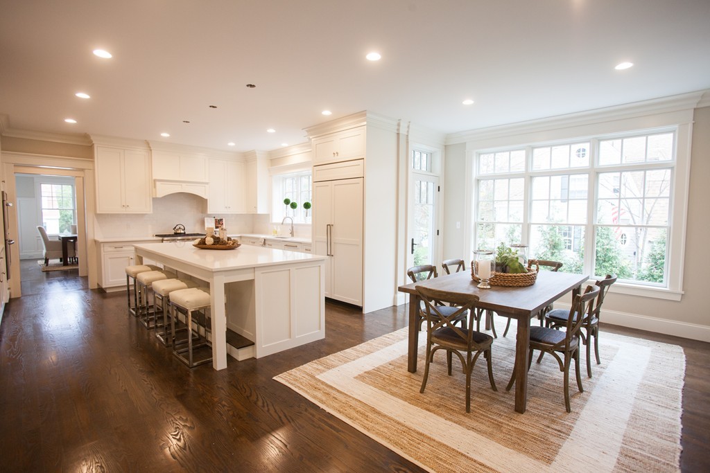 2 Cypress Road Wellesley, MA 02481 - Photo 8 of 22 a kitchen with a table chairs stove and white cabinets
