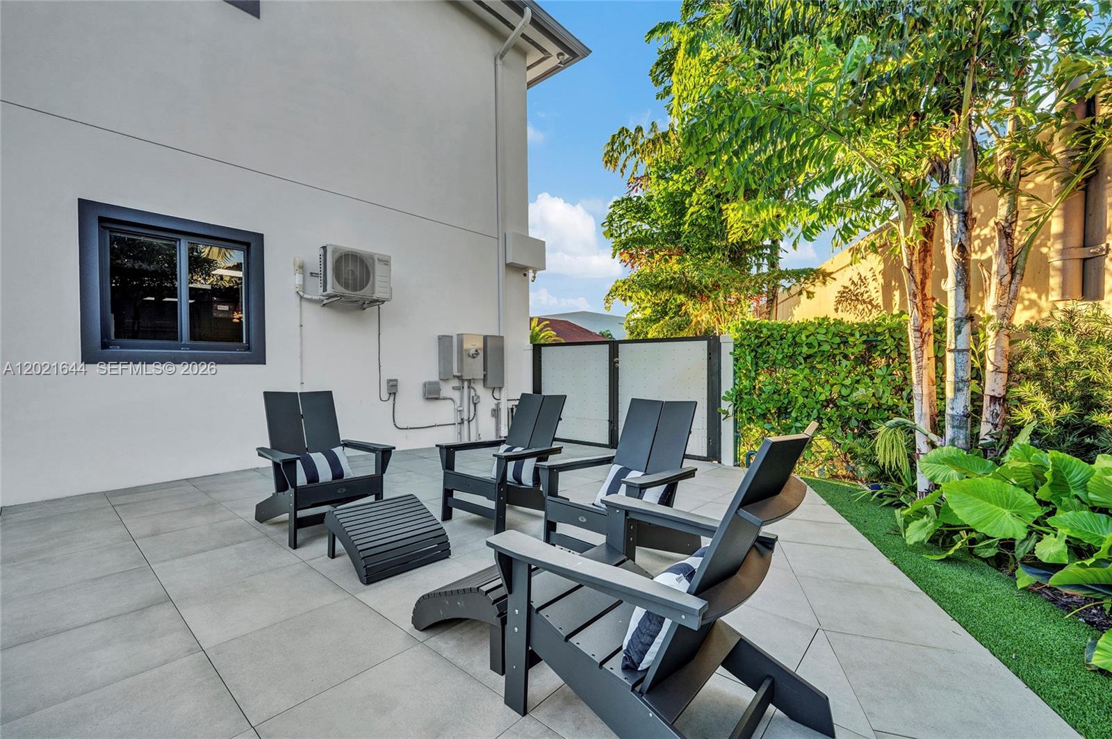 7800 Southwest 9th Terrace Miami, FL 33144 - Photo 13 of 64 a view of a patio with table and chairs and potted plants
