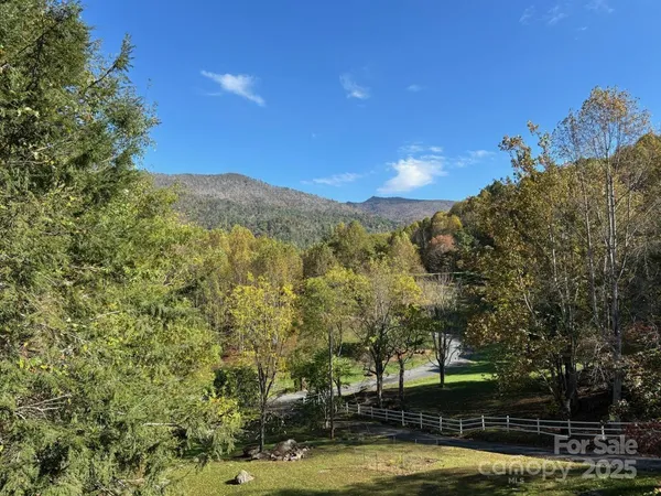 a view of a swimming pool with an outdoor space and seating area