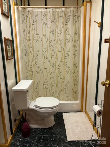 a bathroom with a toilet and a sink