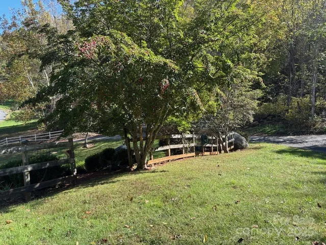 a view of a backyard with sitting area