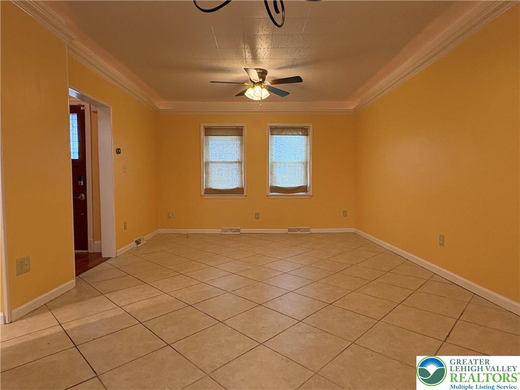 754 East Washington Avenue Bethlehem, PA 18017 - Photo 3 of 19 a view of a livingroom with a chandelier fan and a bathroom