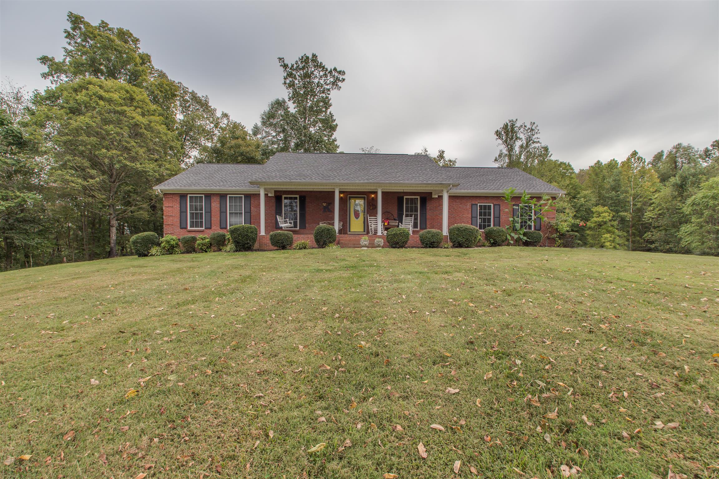 2943 Robert Skelley Road Columbia, TN 38401 - Photo 1 of 30 a front view of a house with a garden