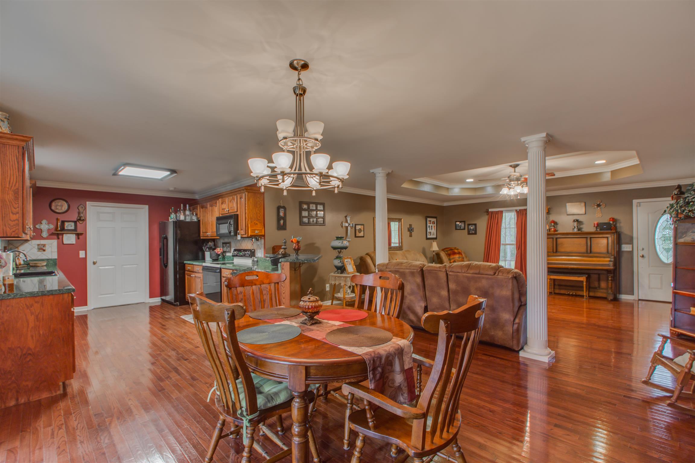 2943 Robert Skelley Road Columbia, TN 38401 - Photo 11 of 30 a view of a dining room with furniture wooden floor and chandelier