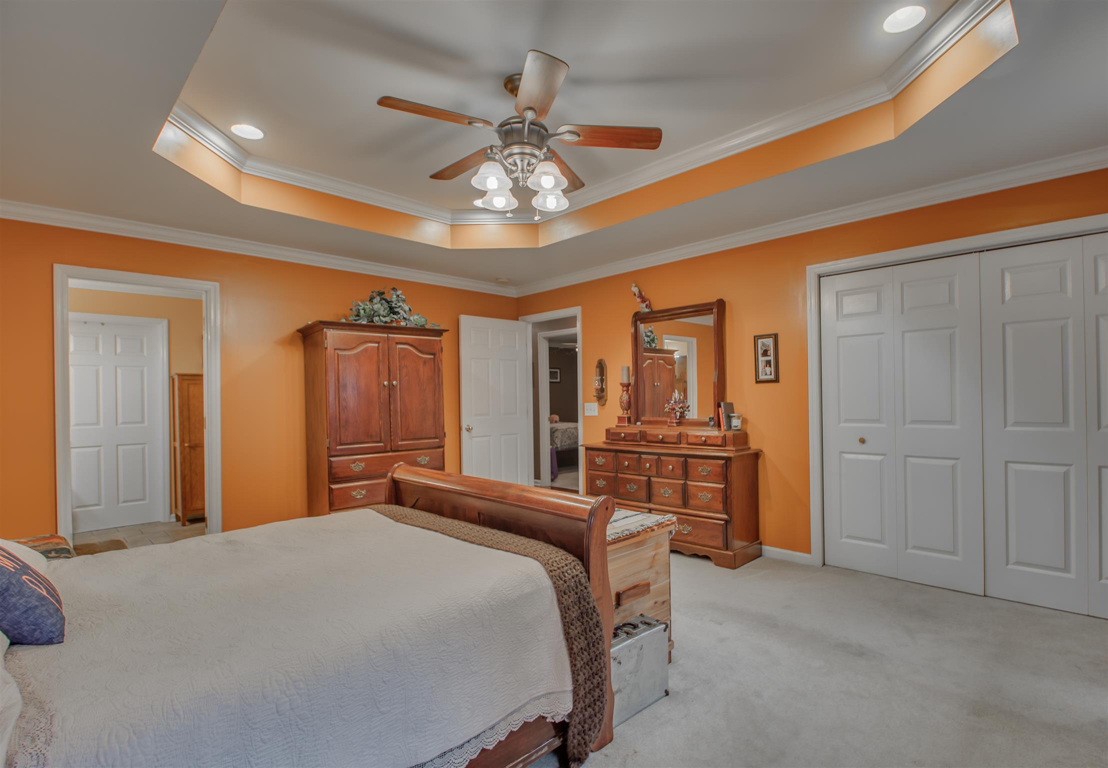 2943 Robert Skelley Road Columbia, TN 38401 - Photo 16 of 30 a bedroom with a large bed and a chandelier