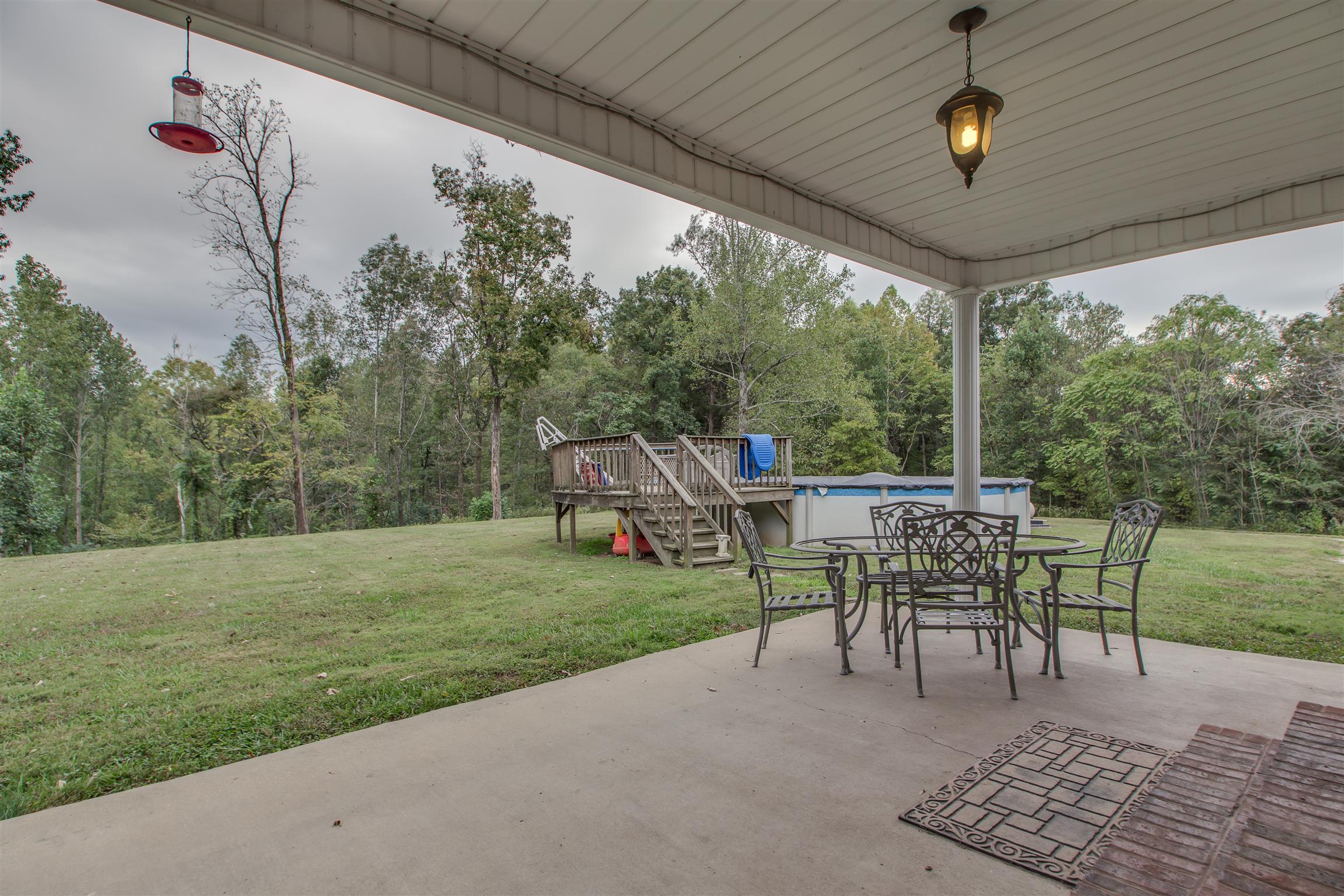 2943 Robert Skelley Road Columbia, TN 38401 - Photo 25 of 30 a view of a porch with furniture and a yard