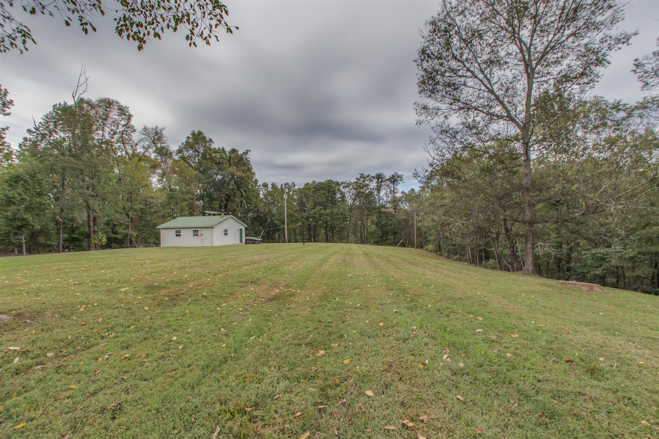 2943 Robert Skelley Road Columbia, TN 38401 - Photo 30 of 30 a house with trees in the background