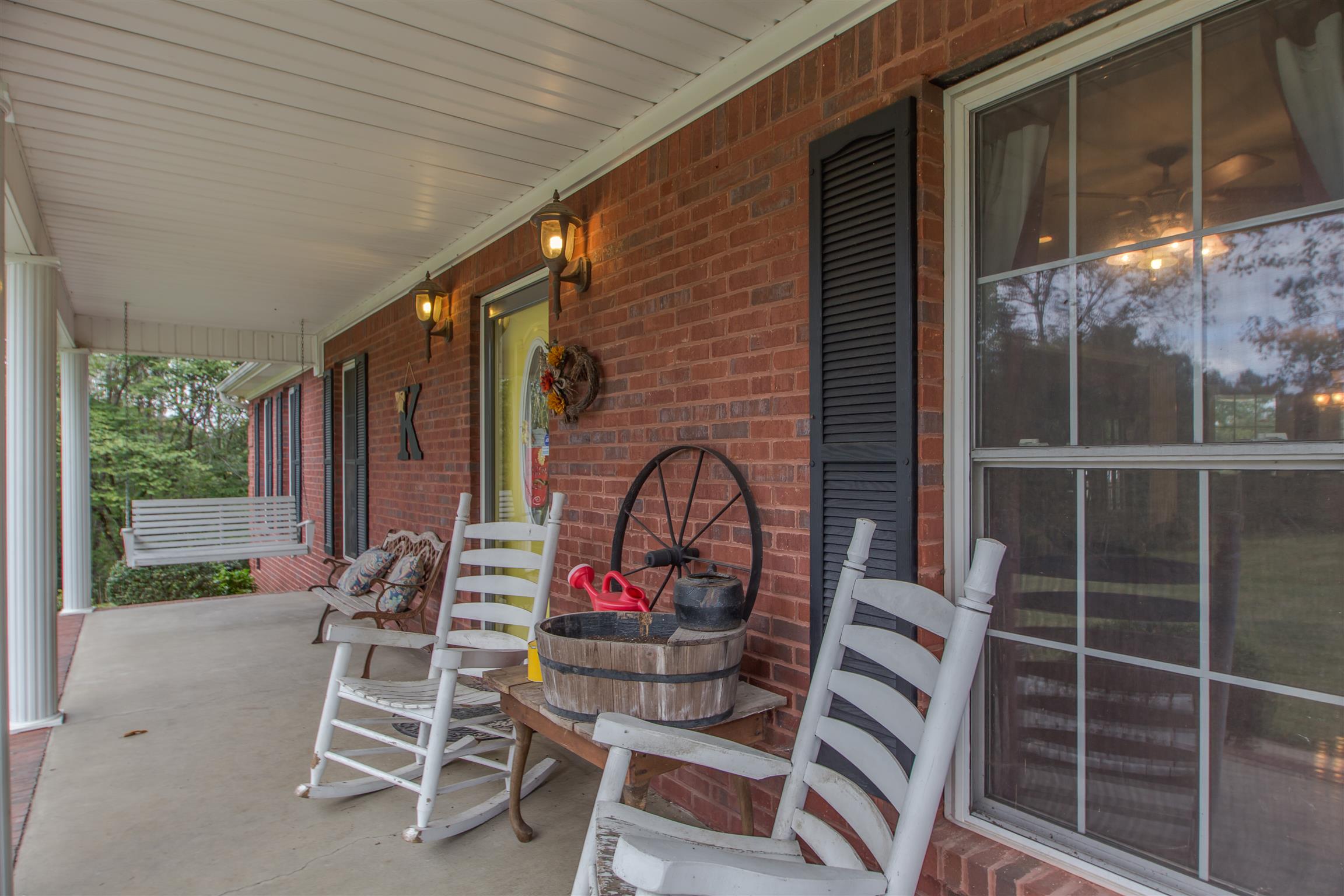 2943 Robert Skelley Road Columbia, TN 38401 - Photo 4 of 30 a view of a chairs and table in patio next to a yard