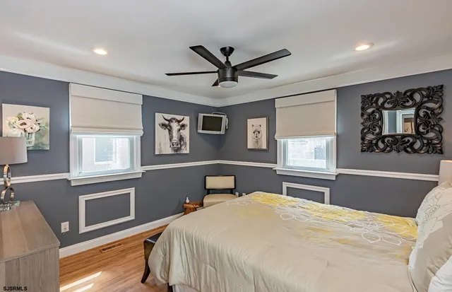 a bedroom with a bed dresser and a window