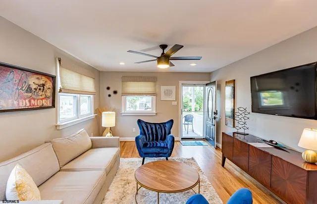 a living room with furniture and a flat screen tv