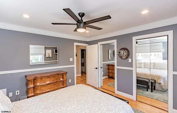 a living room with a large bed and a window
