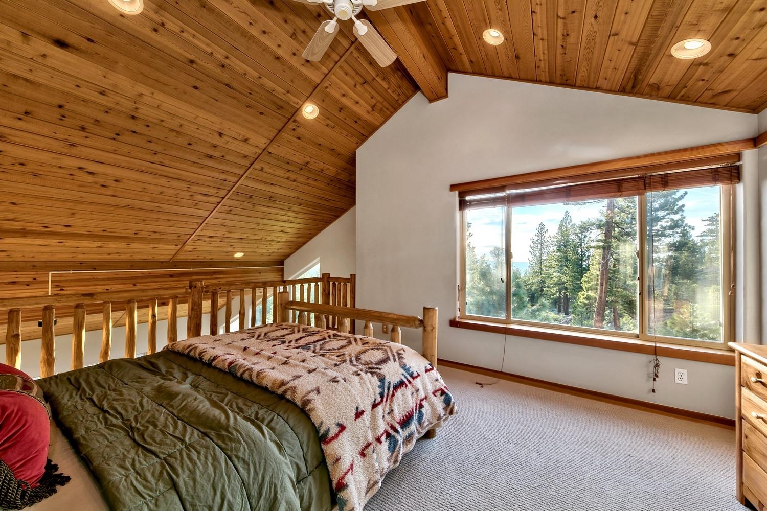16125 Martis Peak Road Truckee, CA 96161 - Photo 13 of 21 a bedroom with a bed and a large window