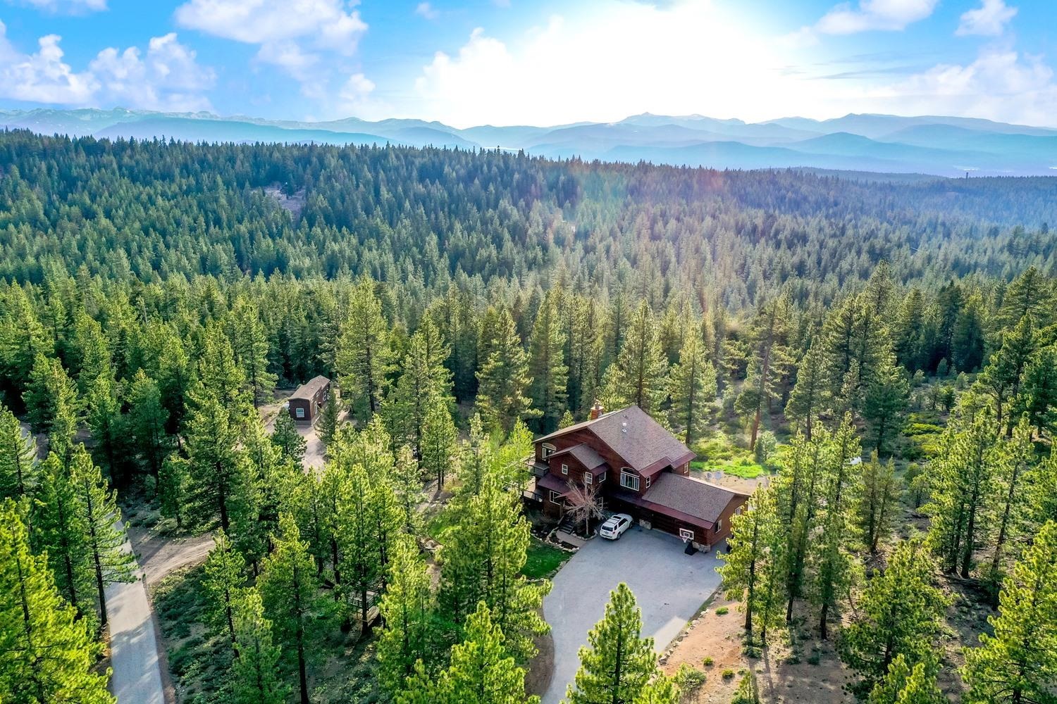 16125 Martis Peak Road Truckee, CA 96161 - Photo 20 of 21 a view of a two chairs in a lush green field