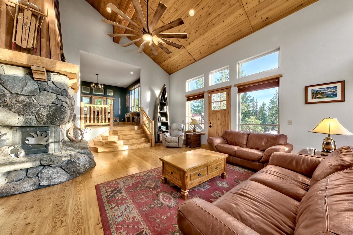 16125 Martis Peak Road Truckee, CA 96161 - Photo 8 of 21 a living room with furniture a chandelier and a large window