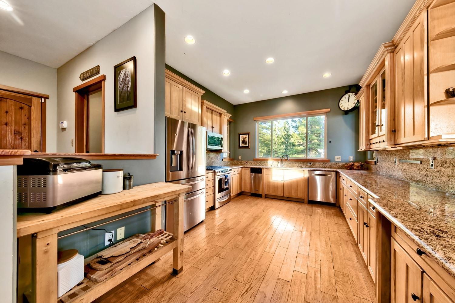 16125 Martis Peak Road Truckee, CA 96161 - Photo 10 of 21 a large kitchen with stainless steel appliances granite countertop a lot of counter space and wooden floors