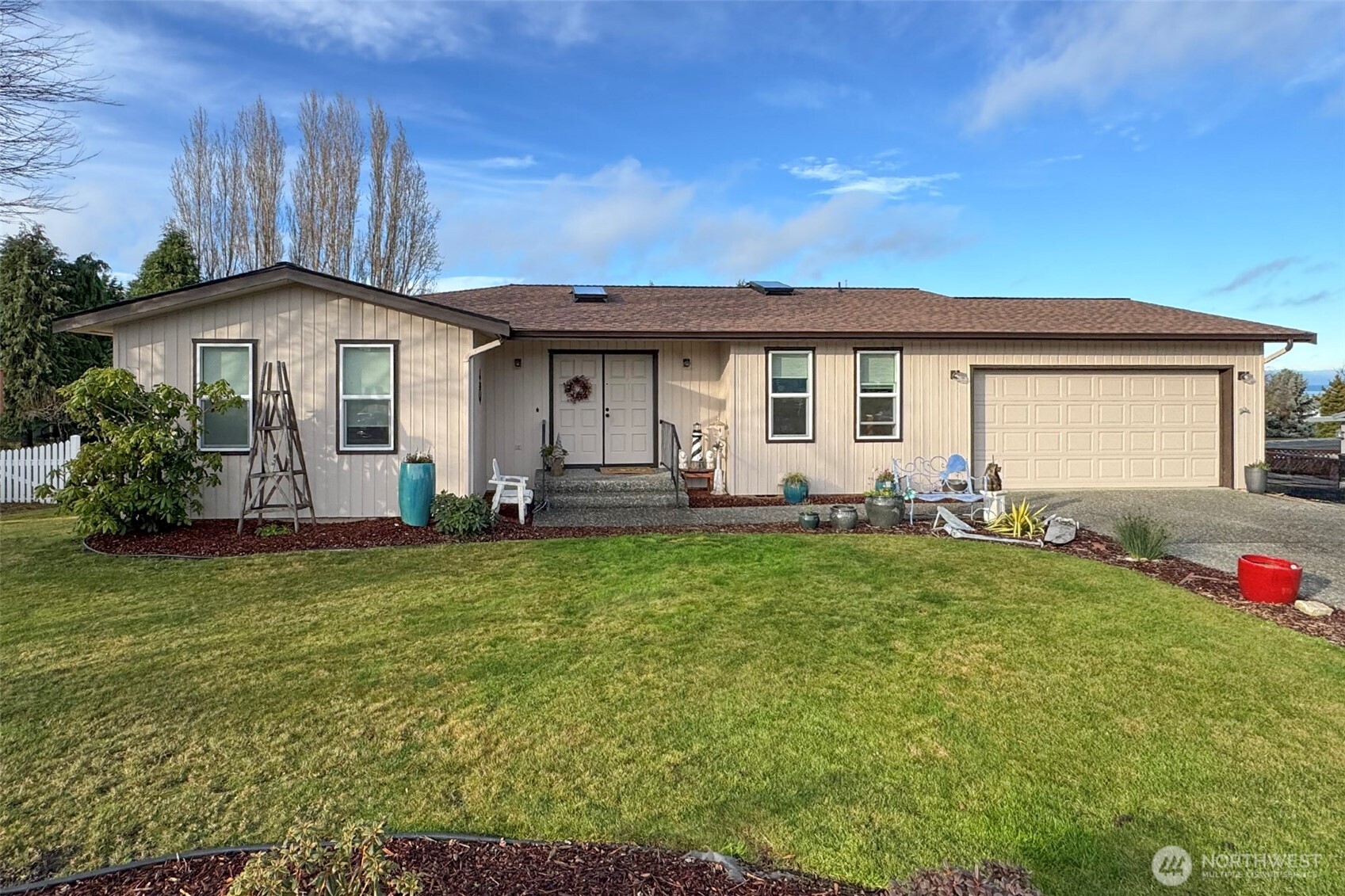 a front view of a house with garden