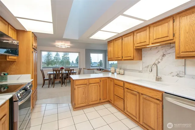 a kitchen with a sink and cabinets