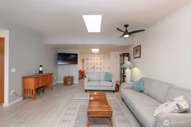 a view of a livingroom with wooden floor and a couch