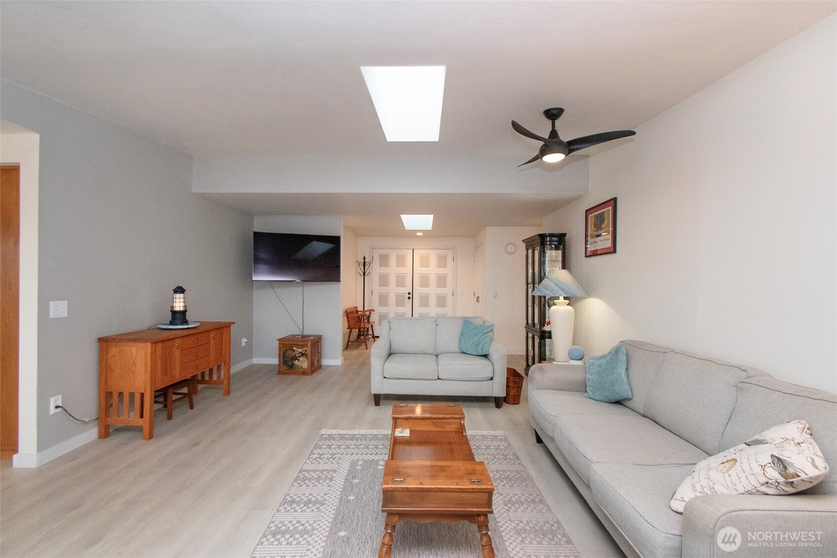 440 West Nelson Road Sequim, WA 98382 - Photo 18 of 39 a living room with furniture and a flat screen tv