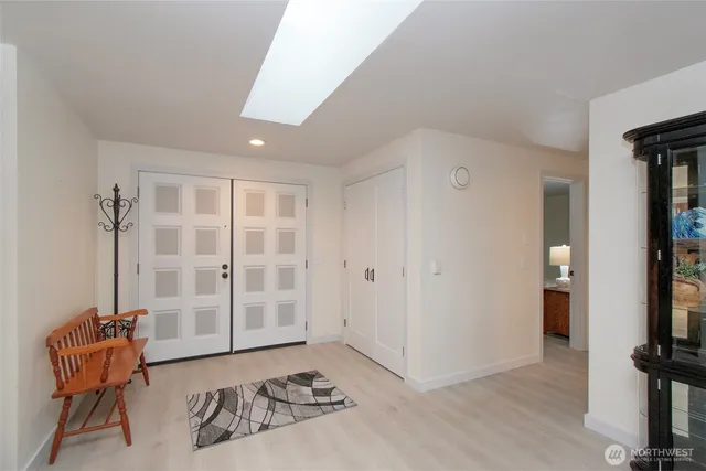 a bed room with a bed and a chair