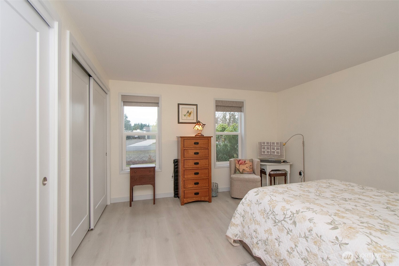 440 West Nelson Road Sequim, WA 98382 - Photo 20 of 39 a bed room with a bed and a chair