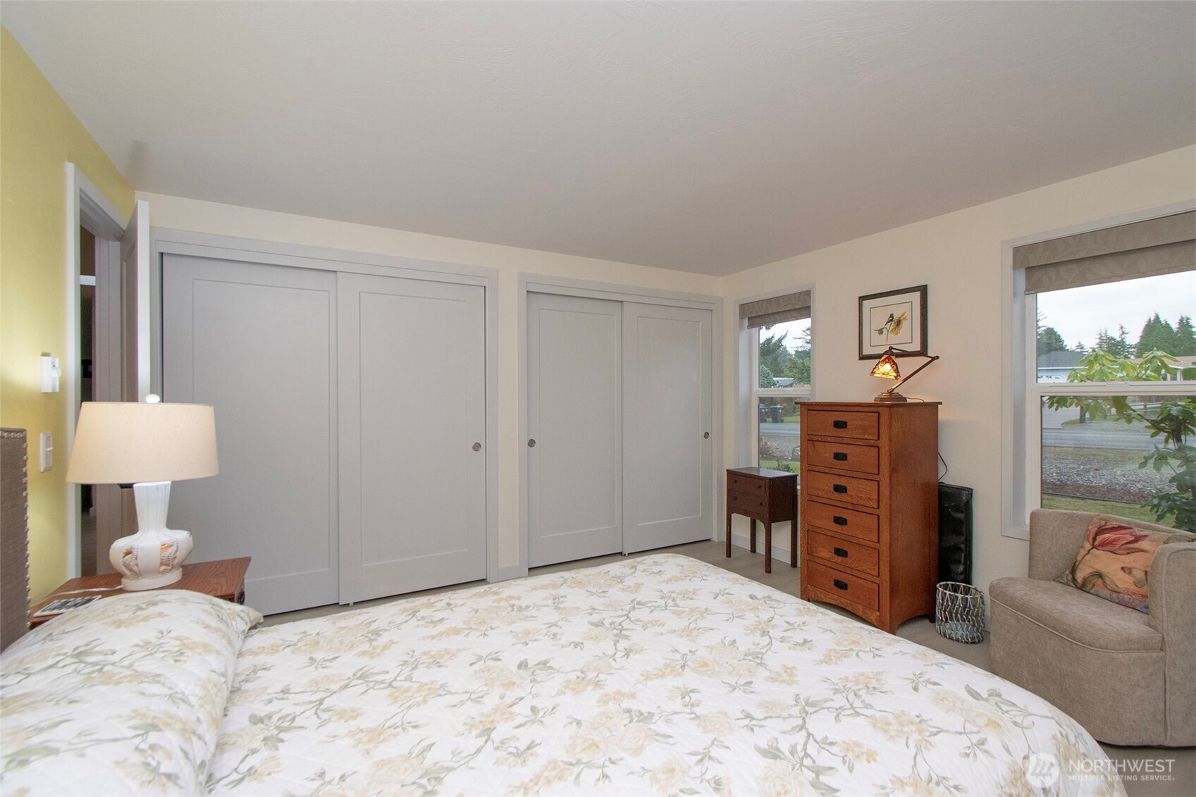 440 West Nelson Road Sequim, WA 98382 - Photo 21 of 39 a bedroom with a bed and a dresser in it