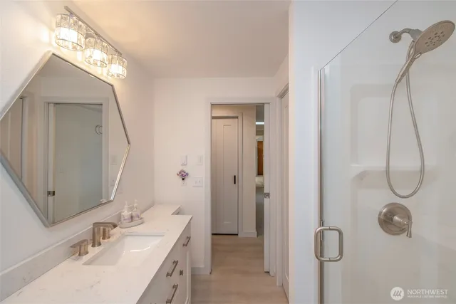 a bathroom with a sink and a mirror