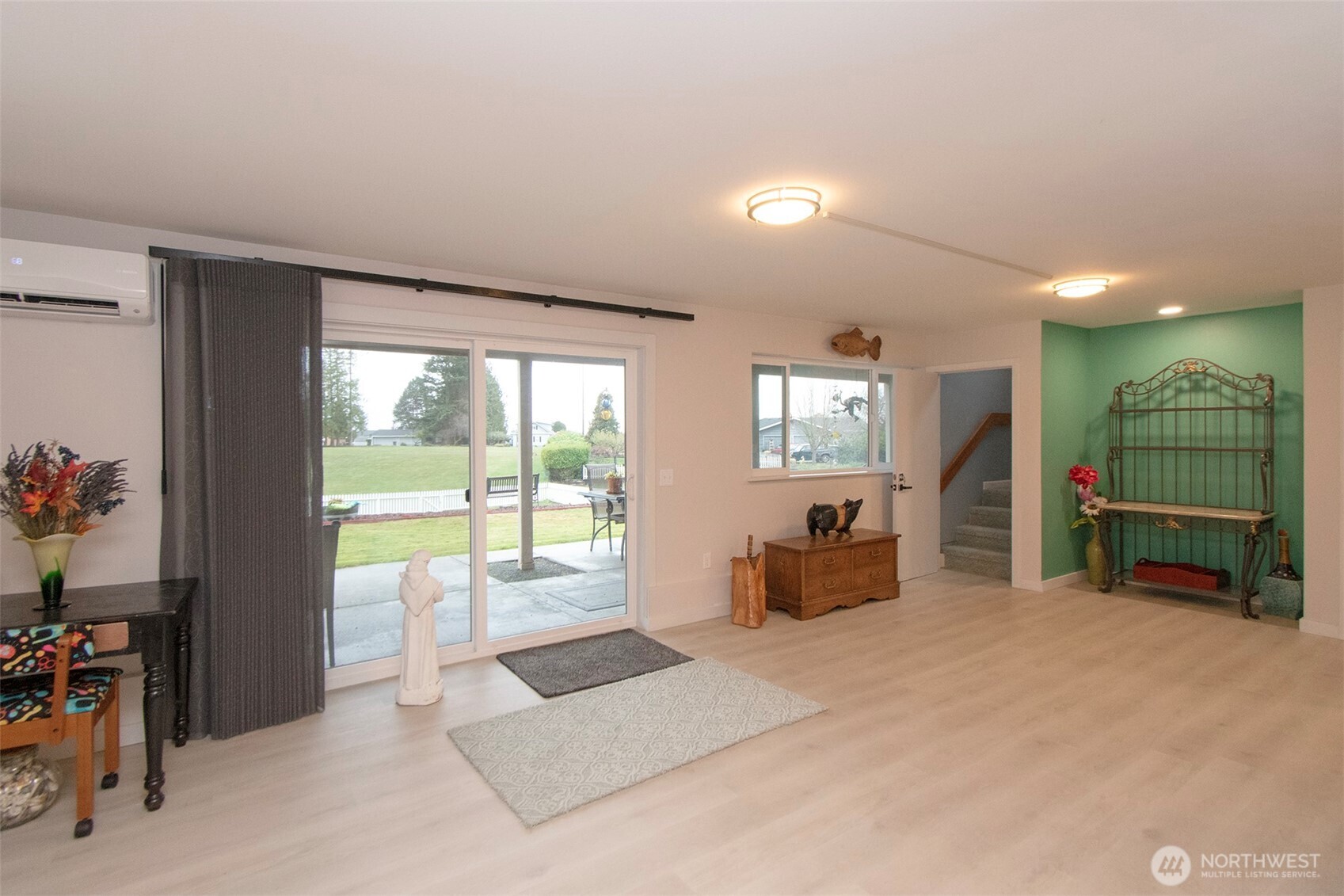 440 West Nelson Road Sequim, WA 98382 - Photo 27 of 39 a spacious bedroom with a bed and a large window