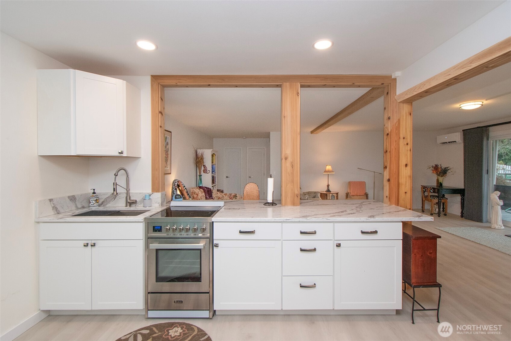 440 West Nelson Road Sequim, WA 98382 - Photo 28 of 39 a kitchen with a sink stove and cabinets