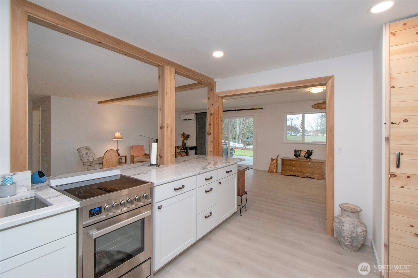 440 West Nelson Road Sequim, WA 98382 - Photo 29 of 39 a kitchen that has a sink and a stove with white countertops