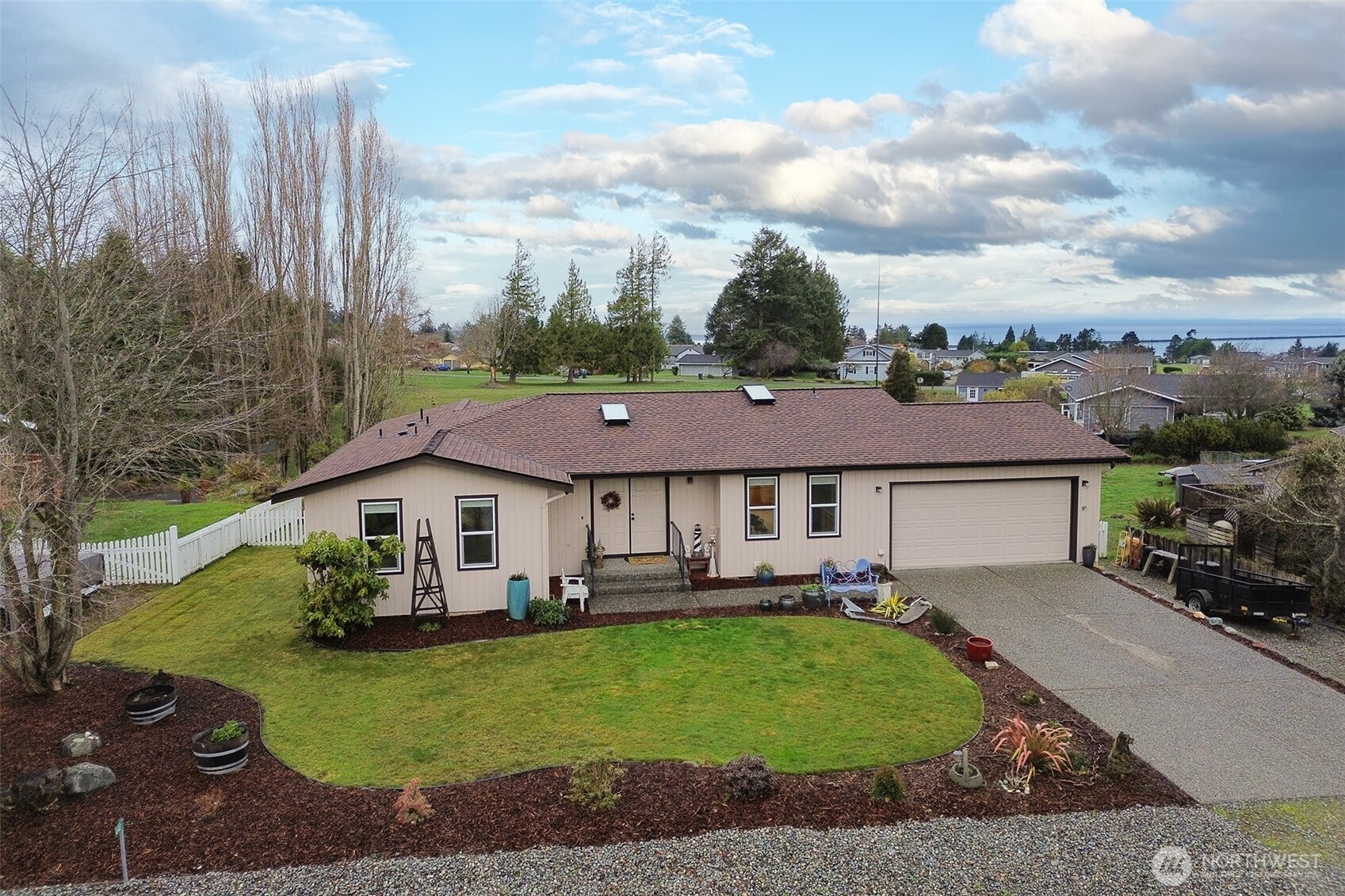 440 West Nelson Road Sequim, WA 98382 - Photo 3 of 39 a aerial view of a house with table and chairs