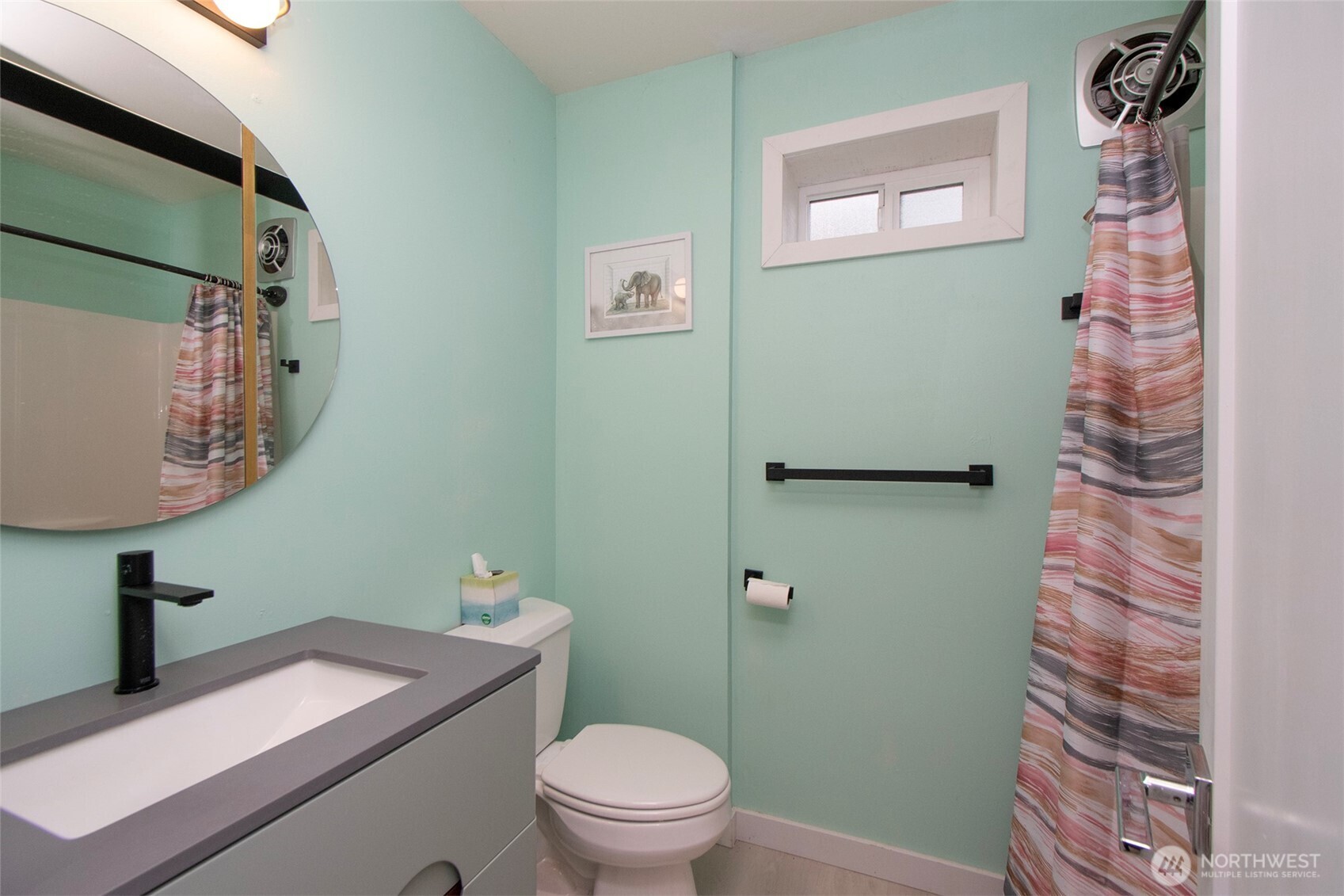 440 West Nelson Road Sequim, WA 98382 - Photo 32 of 39 a bathroom with a granite countertop toilet sink and mirror