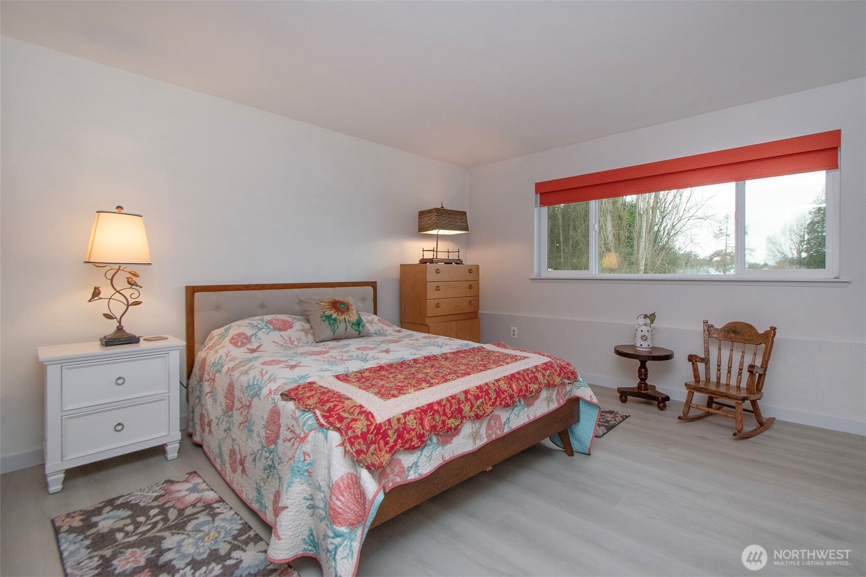 440 West Nelson Road Sequim, WA 98382 - Photo 33 of 39 a bedroom with a bed and a lounge chair