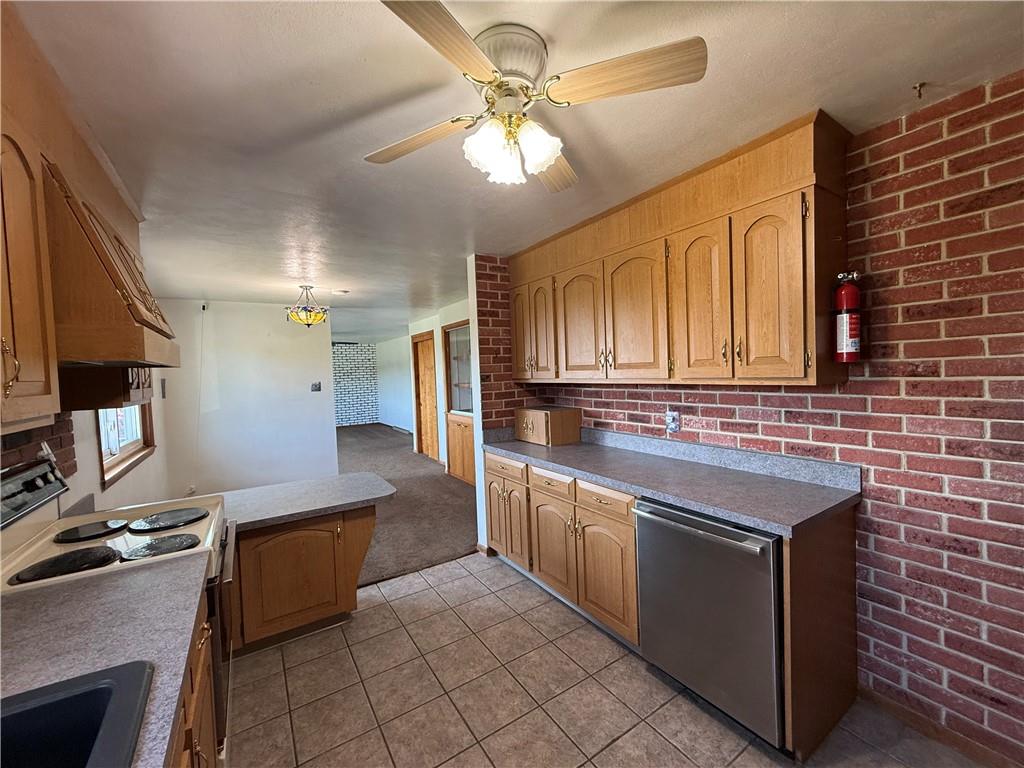 105 Ridgeview Drive Salix, PA 15952 - Photo 6 of 25 a kitchen with stainless steel appliances granite countertop a sink stove and refrigerator