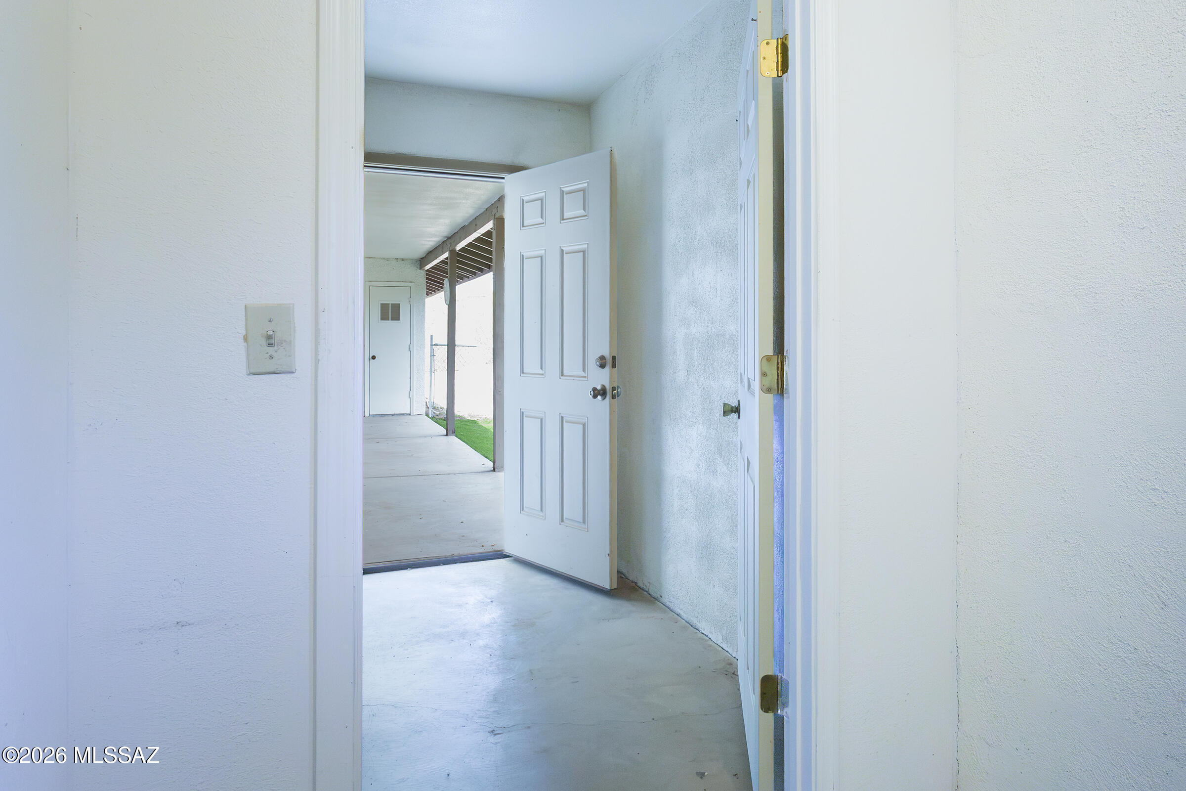 1081 Paseo Freno Rio Rico, AZ 85648 - Photo 31 of 46 a view of a hallway with a yellow room