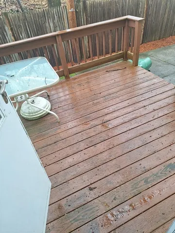 a view of balcony with wooden floor