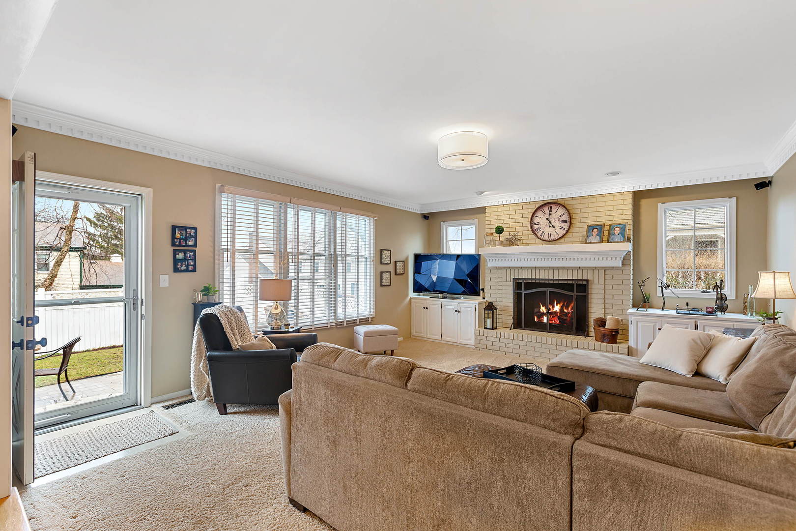 2706 Pebblebrook Lane Rolling Meadows, IL 60008 - Photo 14 of 34 a living room with furniture and a fireplace