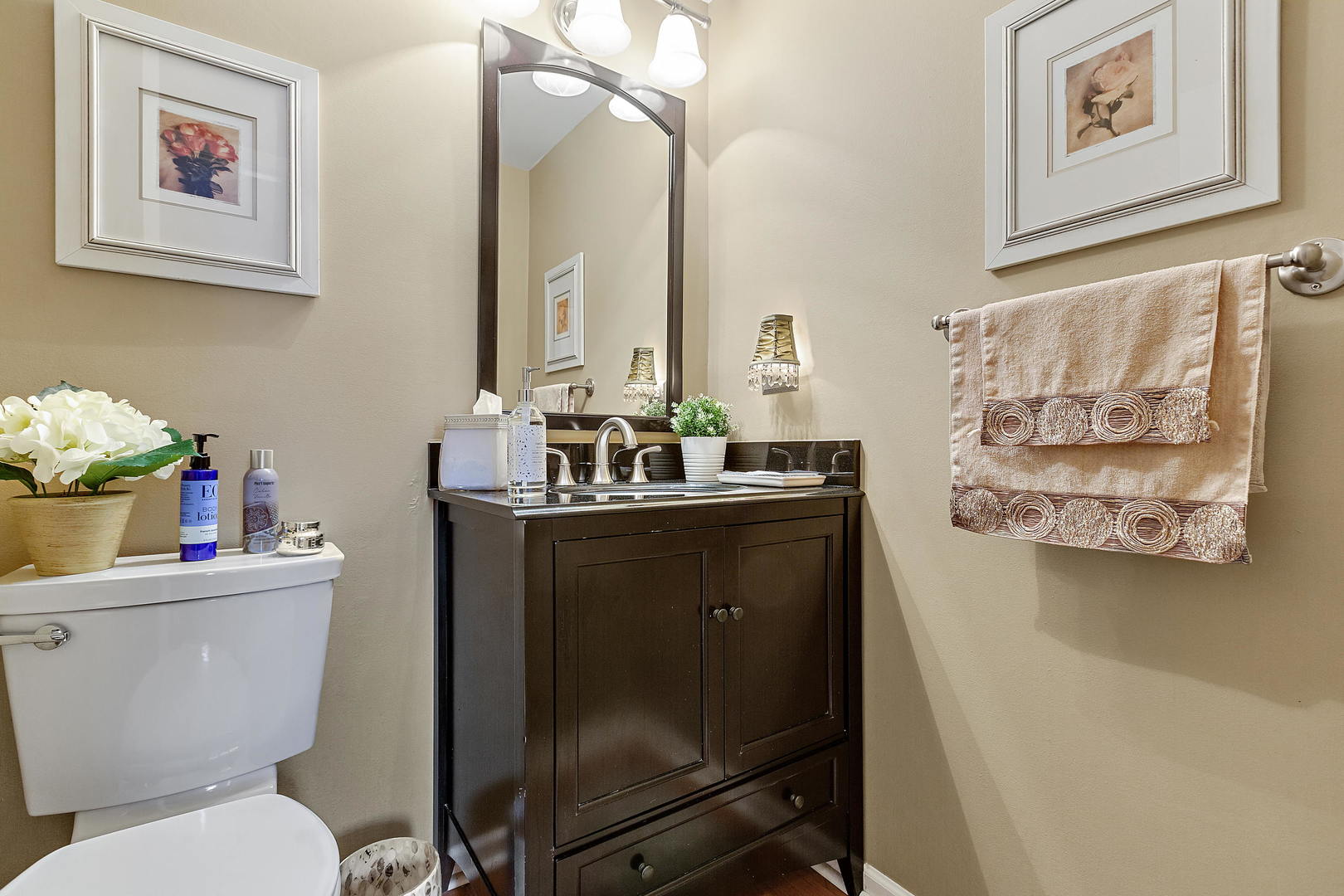 2706 Pebblebrook Lane Rolling Meadows, IL 60008 - Photo 15 of 34 a bathroom with a toilet sink and mirror