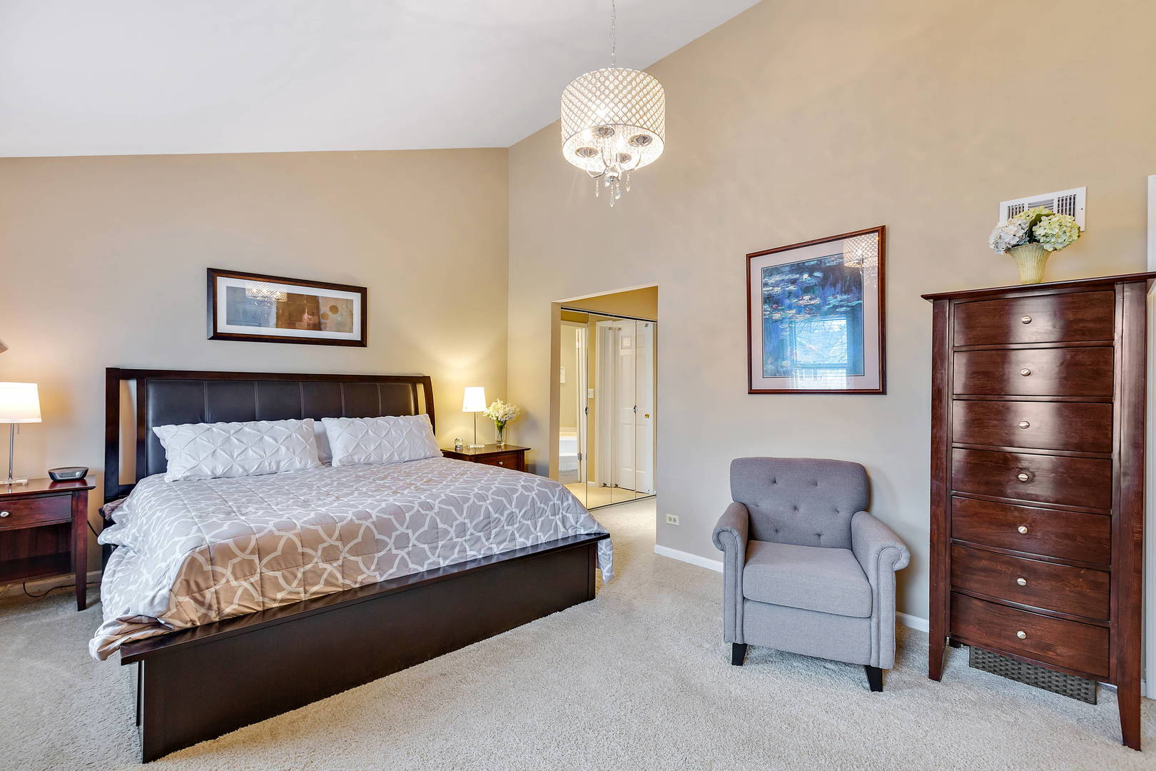 2706 Pebblebrook Lane Rolling Meadows, IL 60008 - Photo 17 of 34 a bedroom with a bed mirror and wall painting