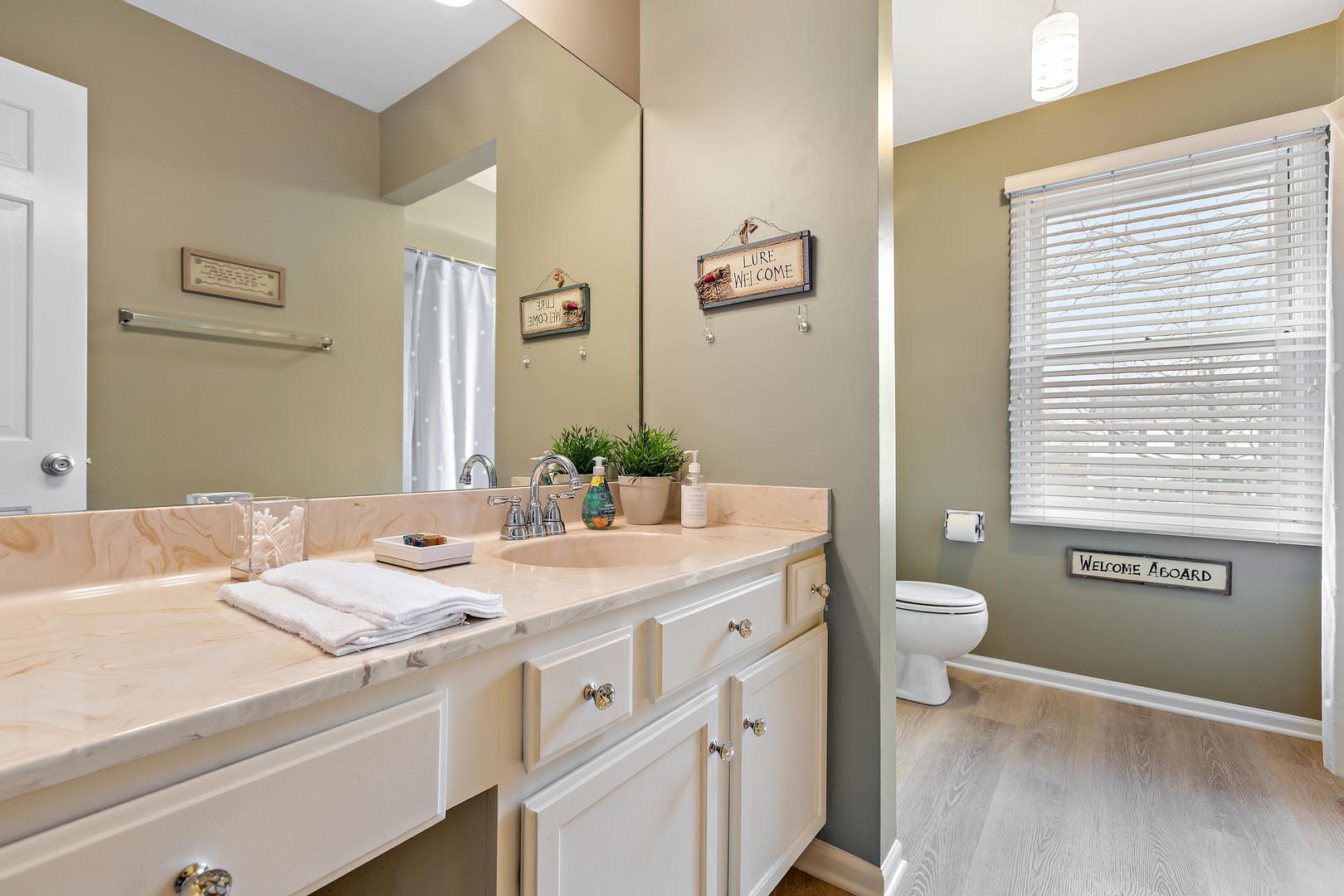 2706 Pebblebrook Lane Rolling Meadows, IL 60008 - Photo 23 of 34 a bathroom with a granite countertop sink and a mirror