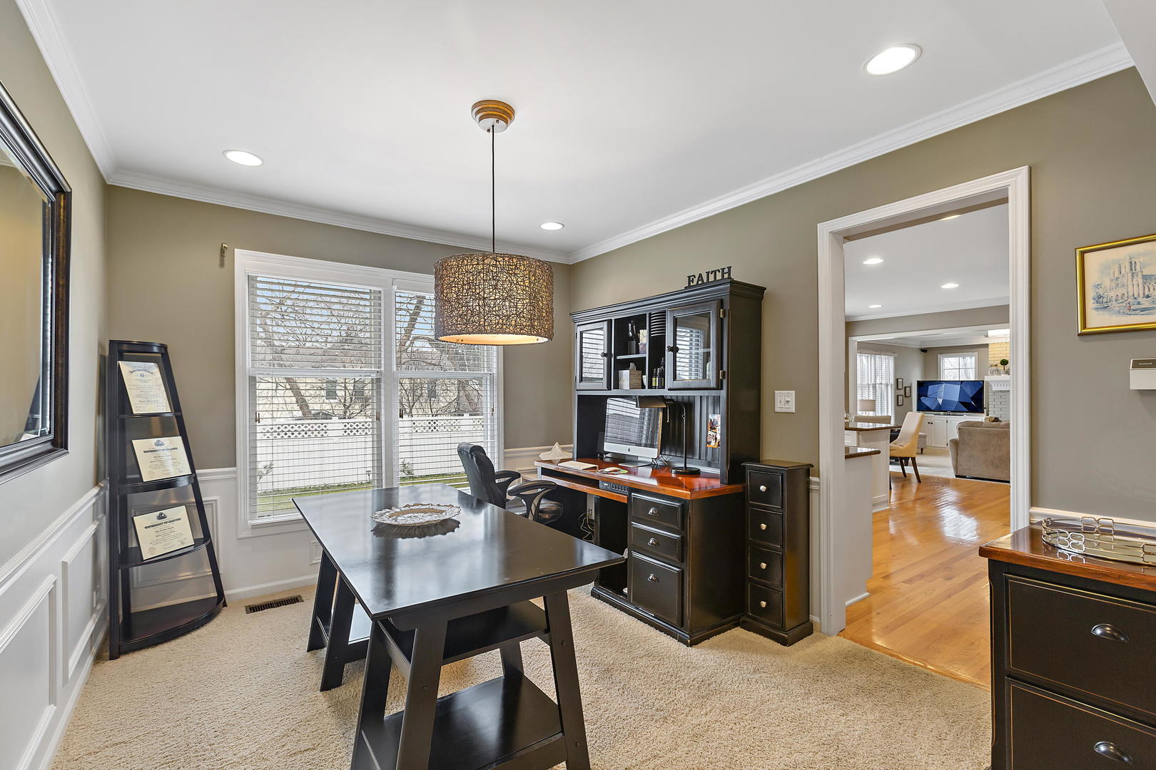 2706 Pebblebrook Lane Rolling Meadows, IL 60008 - Photo 7 of 34 a view of a workspace with furniture and a book shelf
