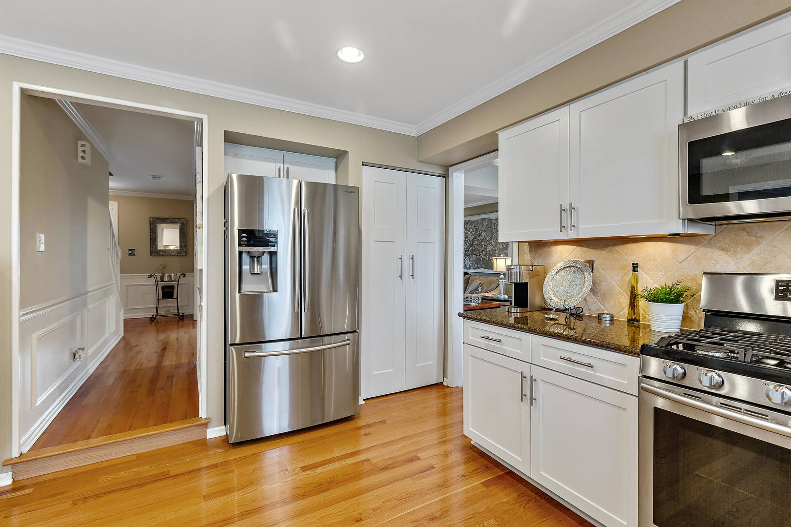2706 Pebblebrook Lane Rolling Meadows, IL 60008 - Photo 9 of 34 a kitchen with stainless steel appliances granite countertop a refrigerator and a stove top oven