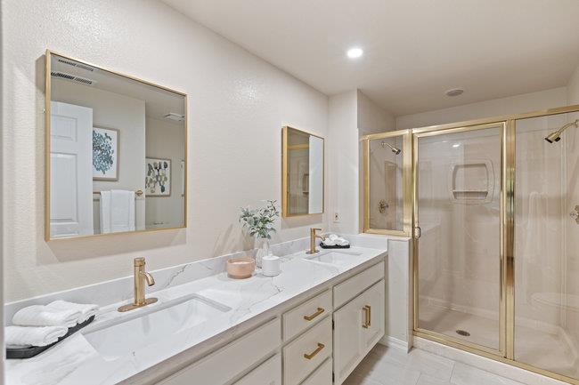 2101 Ornellas Drive Milpitas, CA 95035 - Photo 12 of 17 a bathroom with double vanity sinks and a shower