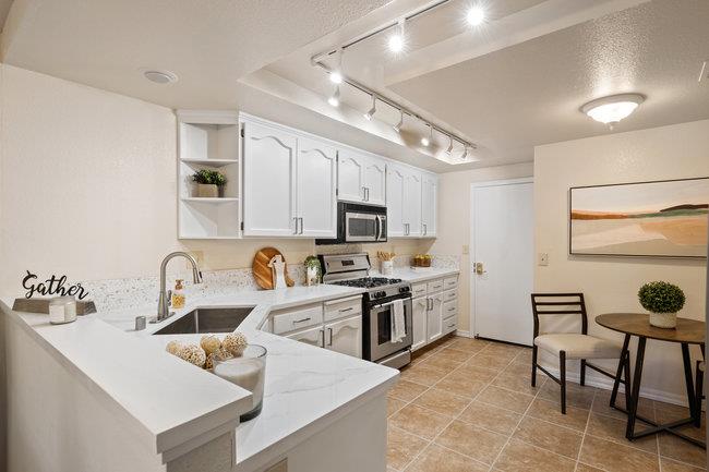 2101 Ornellas Drive Milpitas, CA 95035 - Photo 8 of 17 a kitchen with furniture a sink and appliances