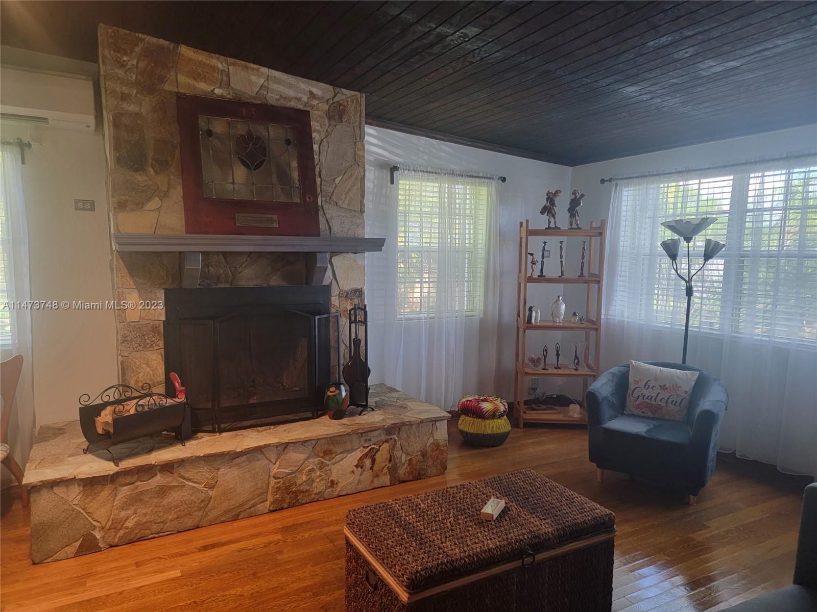 Olympia Heights Miami, FL 33165 - Photo 11 of 45 a living room with furniture and a fireplace