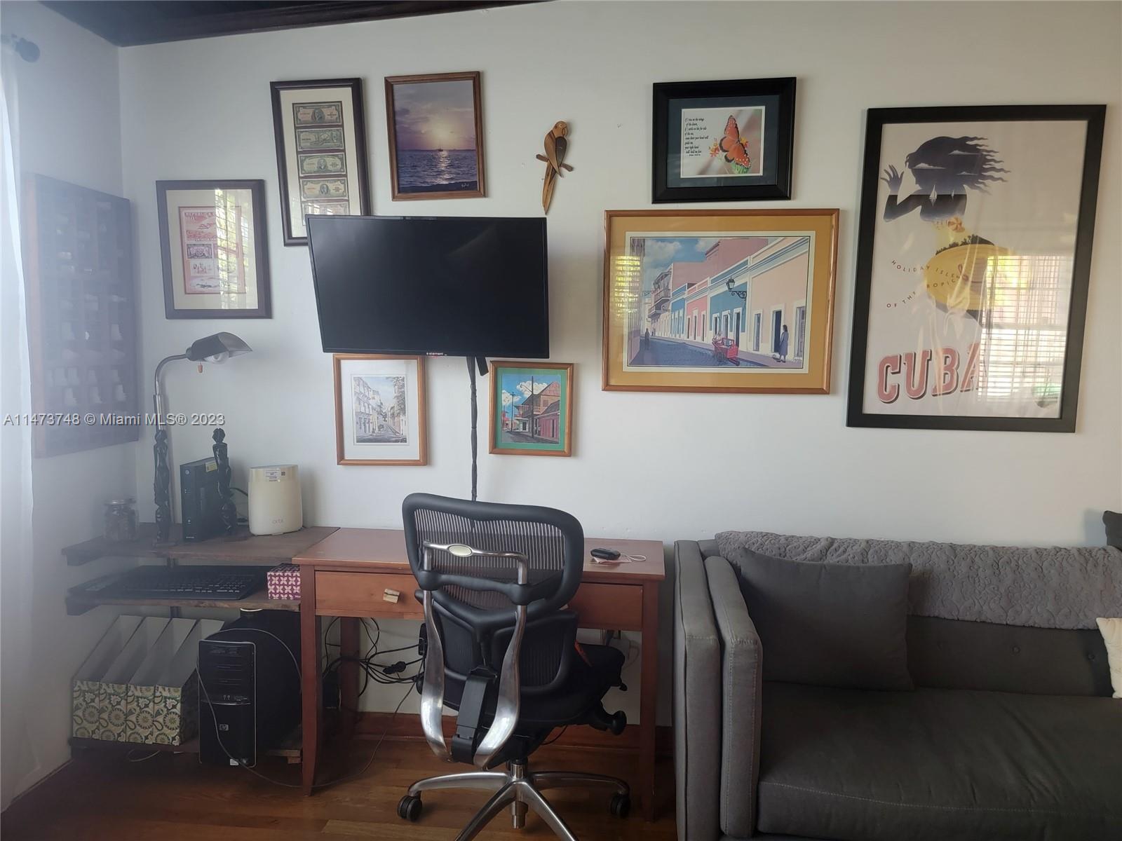 Olympia Heights Miami, FL 33165 - Photo 12 of 45 a view of a livingroom with workspace and a couch