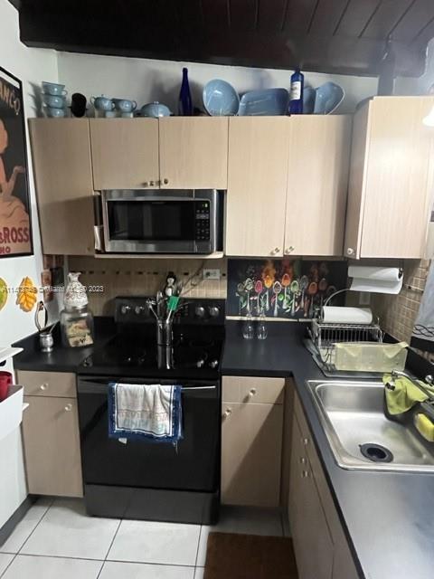 Olympia Heights Miami, FL 33165 - Photo 29 of 45 a kitchen with a sink and a stove top oven